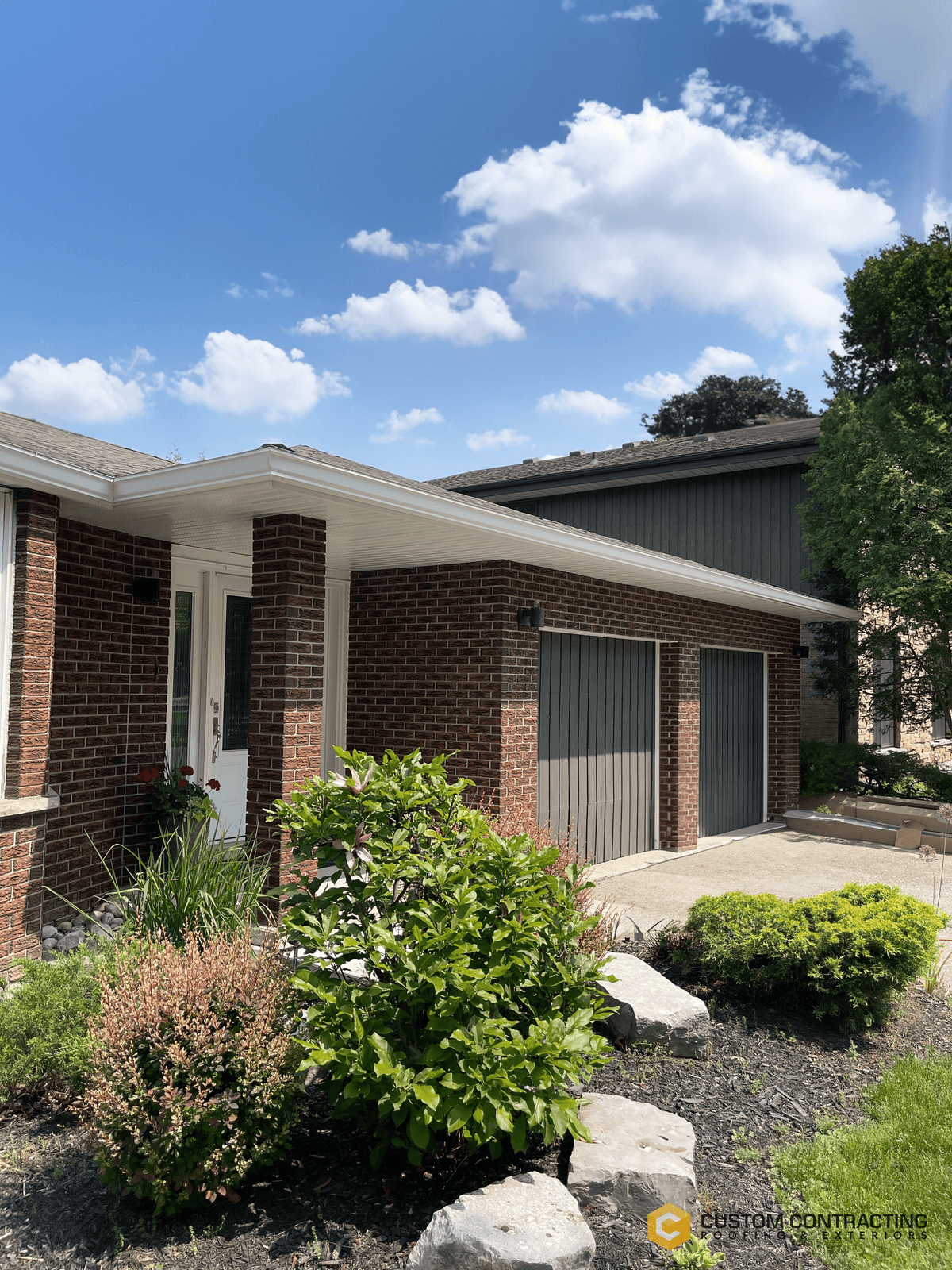 Beautiful residential home exterior protected by Custom Contracting premium roofing and siding